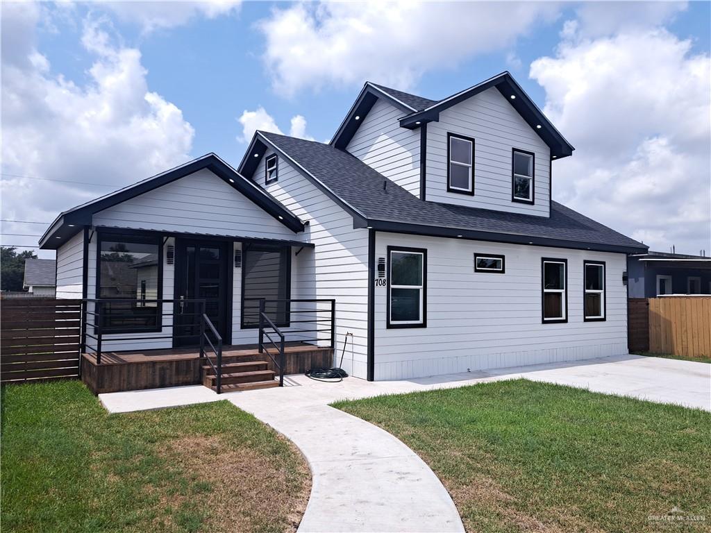 708 East 3rd Avenue Elsa, TX 78543 - Photo 4 of 33 View of front of home with a shingled roof and a porch
