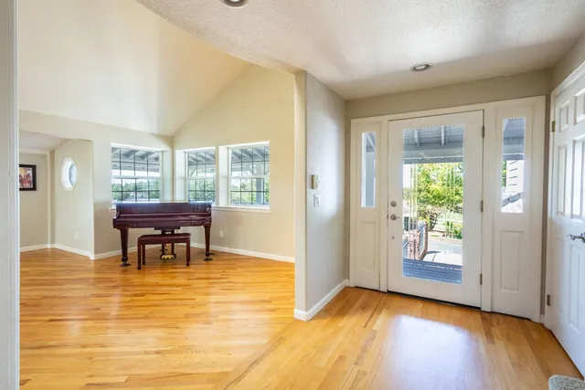 a view of a living room and wooden floor