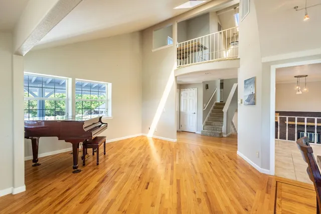 a kitchen with granite countertop cabinets and windows