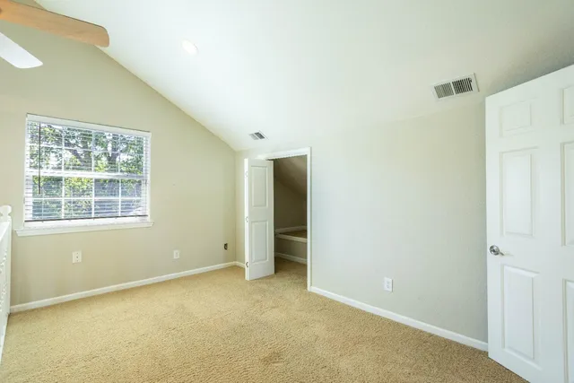 a view of a big room with windows and cabinet