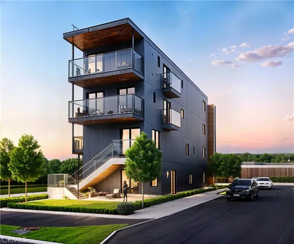 a view of a brick building next to a yard