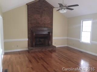 2205 New Salem Road Monroe, NC 28110 - Photo 13 of 18 a view of empty room with wooden floor and fan
