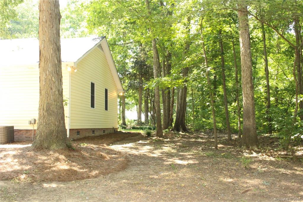2205 New Salem Road Monroe, NC 28110 - Photo 6 of 18 a view of a house with backyard and trees