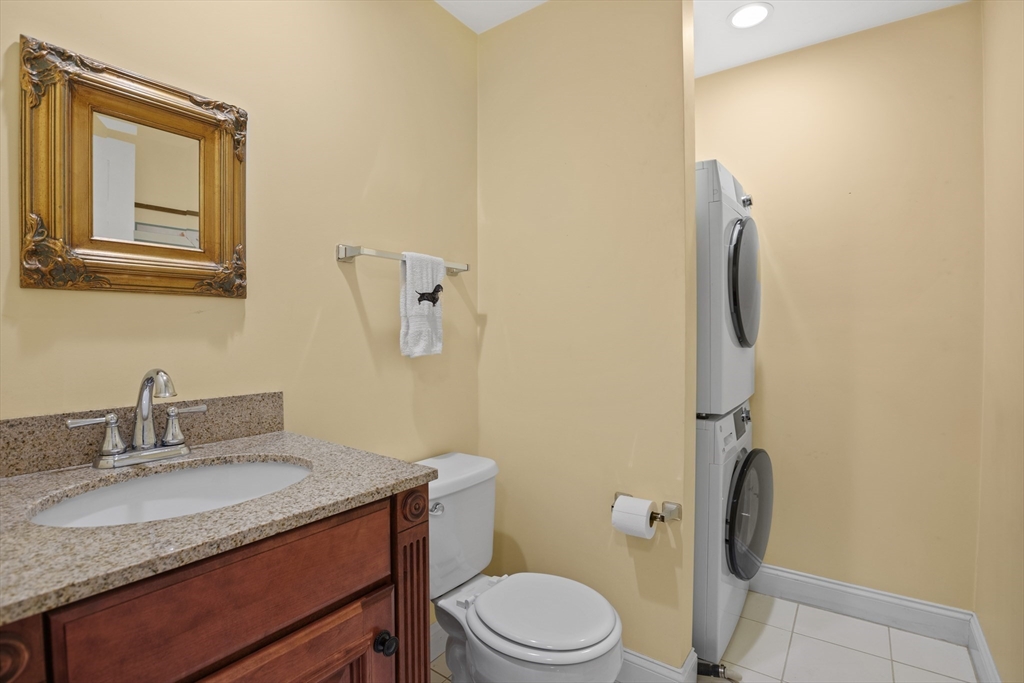 12 Hall Road Chelmsford, MA 01824 - Photo 14 of 32 a bathroom with a granite countertop sink toilet and mirror