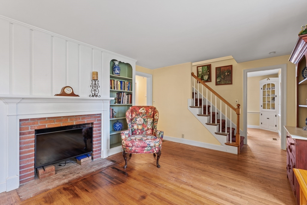 12 Hall Road Chelmsford, MA 01824 - Photo 15 of 32 a living room with furniture and a fireplace