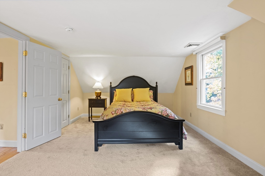 12 Hall Road Chelmsford, MA 01824 - Photo 16 of 32 a bedroom with a bed and a window