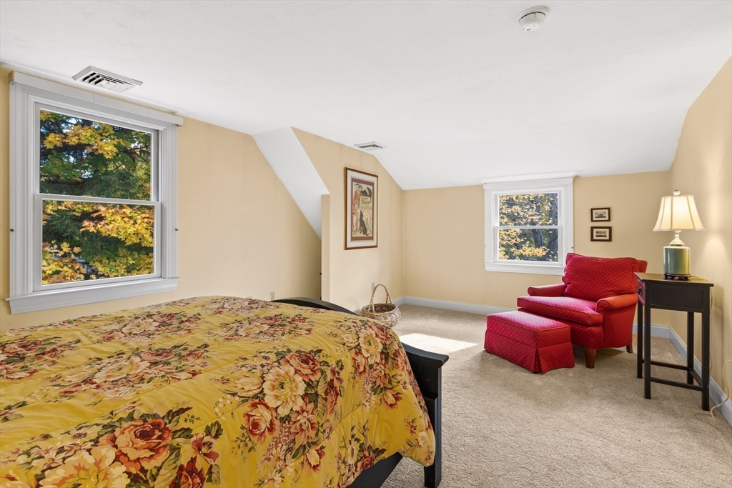 12 Hall Road Chelmsford, MA 01824 - Photo 17 of 32 a bedroom with a bed couches chair and a large window