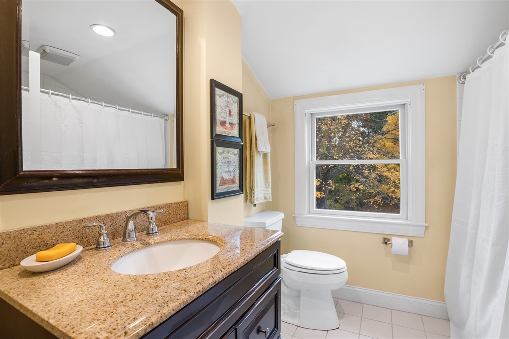 12 Hall Road Chelmsford, MA 01824 - Photo 19 of 32 a bathroom with a granite countertop sink toilet and mirror