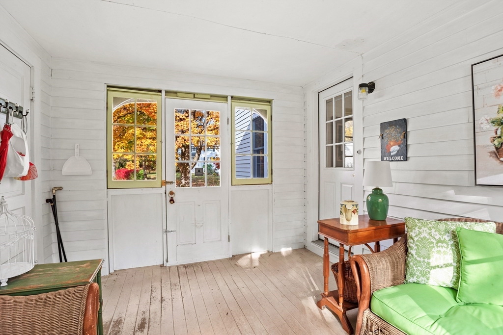 12 Hall Road Chelmsford, MA 01824 - Photo 22 of 32 a view of a livingroom with furniture wooden floor and windows