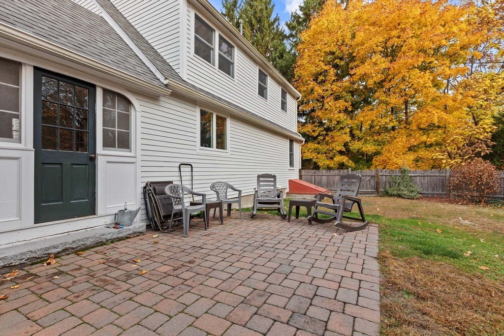 12 Hall Road Chelmsford, MA 01824 - Photo 24 of 32 a backyard of a house with table and chairs
