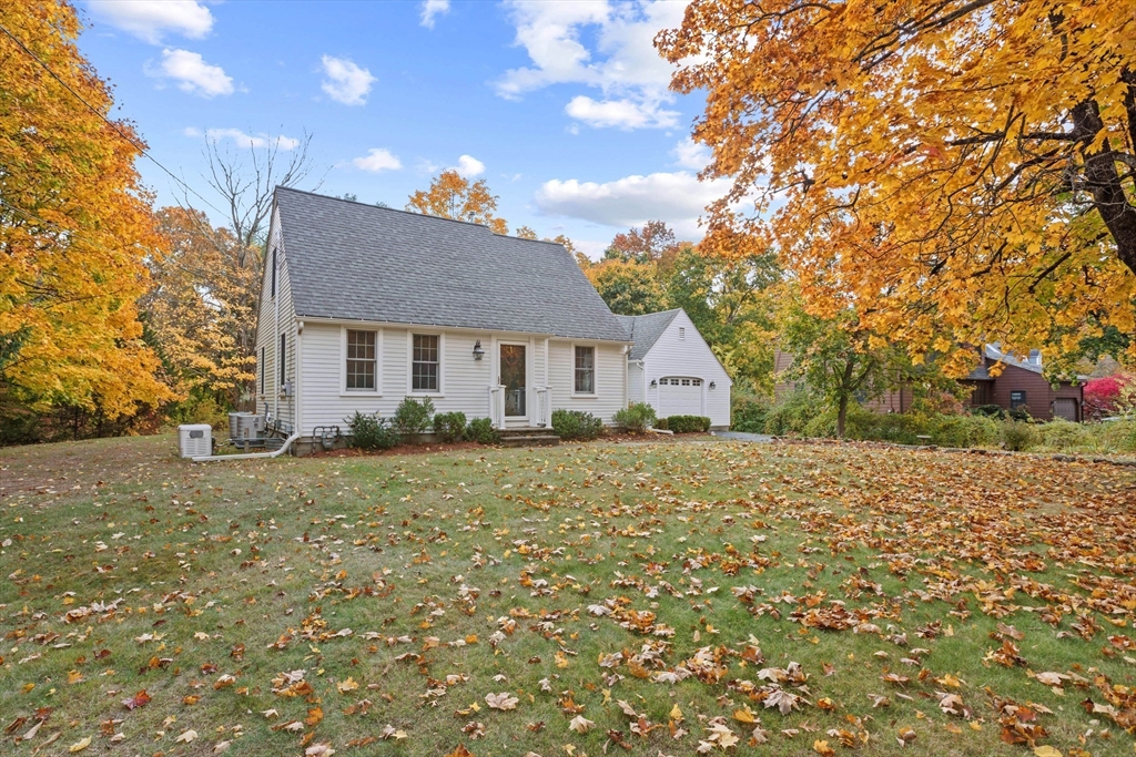 12 Hall Road Chelmsford, MA 01824 - Photo 3 of 32 a yellow house with a tree in front of it