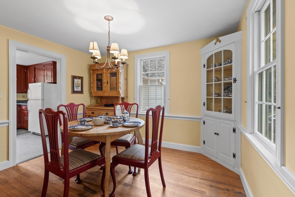 12 Hall Road Chelmsford, MA 01824 - Photo 8 of 32 a view of a dining room with furniture window and wooden floor