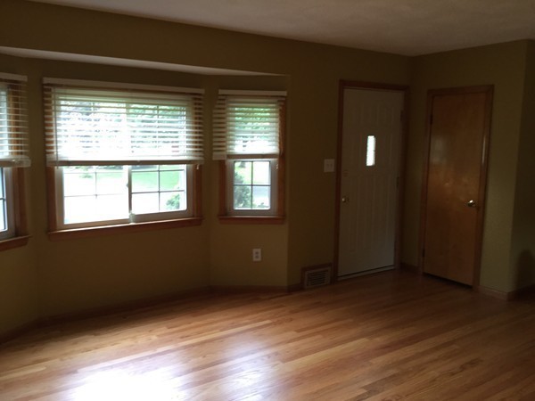 87 Sunnybrook Road Springfield, MA 01119 - Photo 6 of 10 a view of an empty room with wooden floor and a window