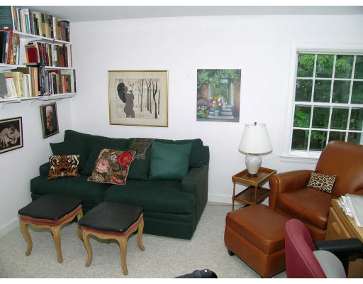 294 Woodcliff Road Newton, MA 02461 - Photo 10 of 11 a living room with furniture and a book shelf