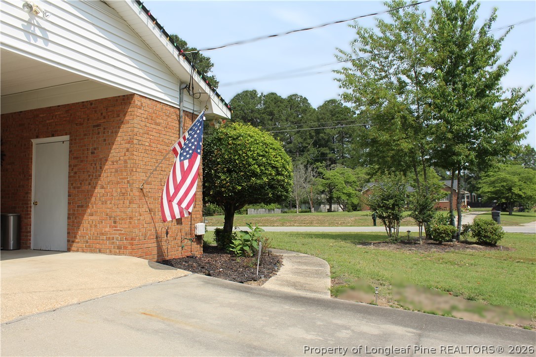 2038 Dunn Road Eastover, NC 28312 - Photo 4 of 29 a front view of a house with a yard