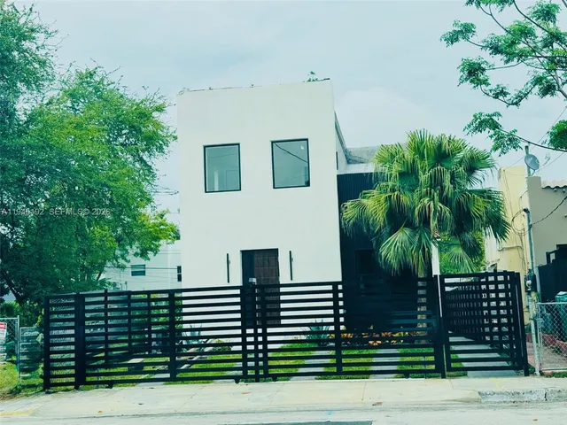 a view of front door and yard