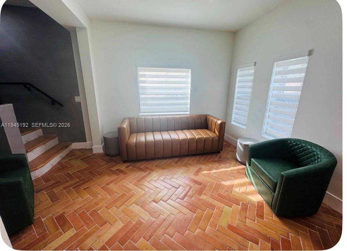 905 Southwest 13th Court Miami, FL 33135 - Photo 11 of 51 a living room with furniture and a window