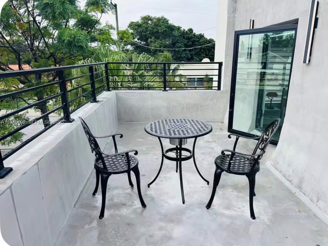 905 Southwest 13th Court Miami, FL 33135 - Photo 17 of 51 a view of a chairs and table in the balcony