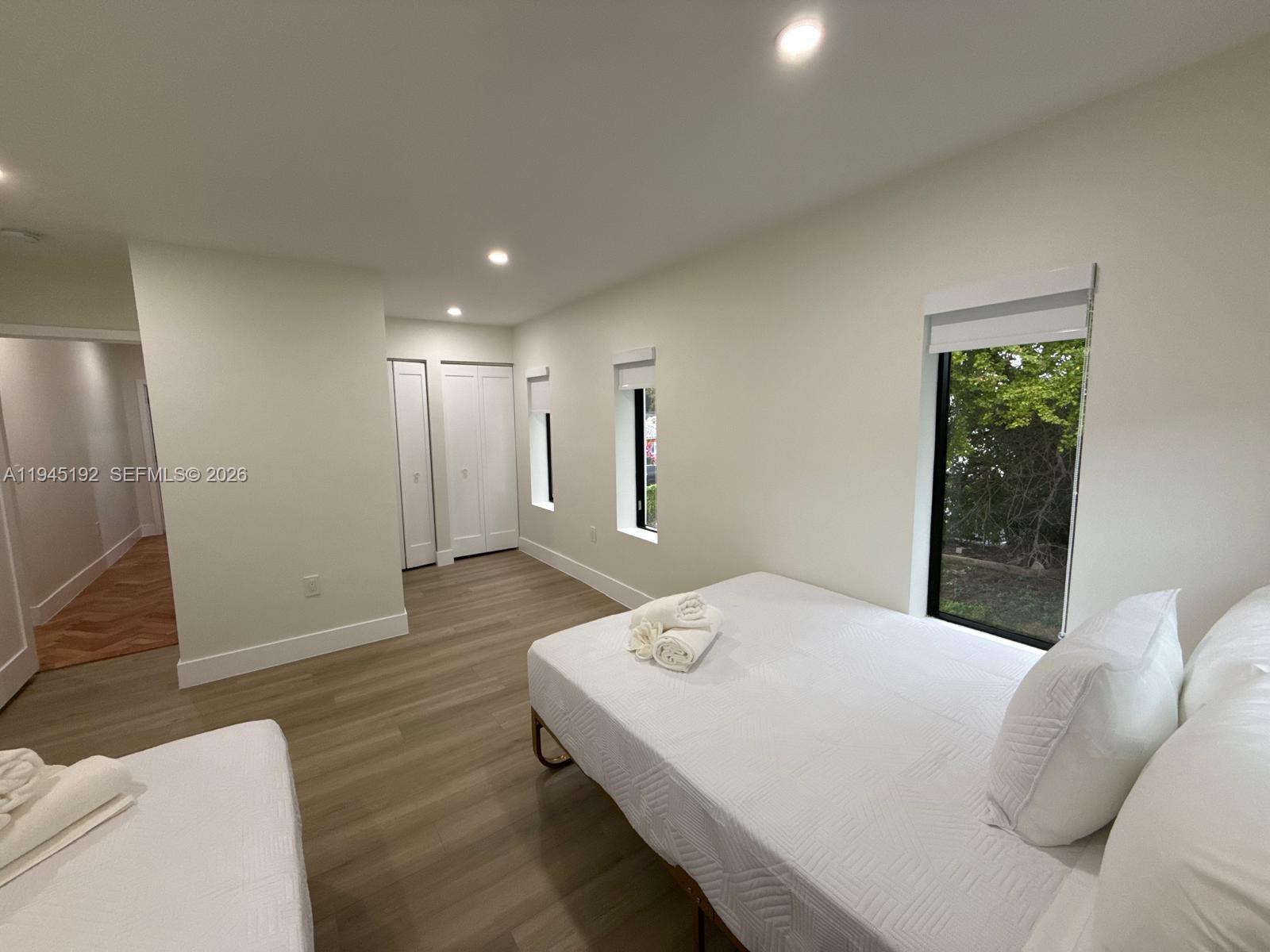 905 Southwest 13th Court Miami, FL 33135 - Photo 21 of 51 a large white bed in a white room