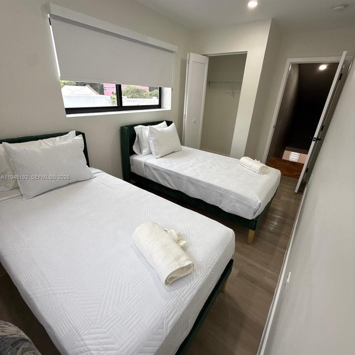 905 Southwest 13th Court Miami, FL 33135 - Photo 22 of 51 a bedroom with two beds and a night stand