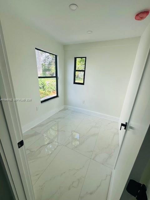 905 Southwest 13th Court Miami, FL 33135 - Photo 35 of 51 a view of room with window and stairs