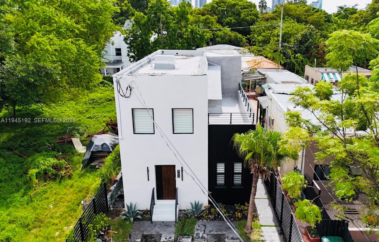905 Southwest 13th Court Miami, FL 33135 - Photo 4 of 51 a aerial view of a house with a yard and plants