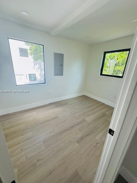 905 Southwest 13th Court Miami, FL 33135 - Photo 44 of 51 an empty room with wooden floor and windows