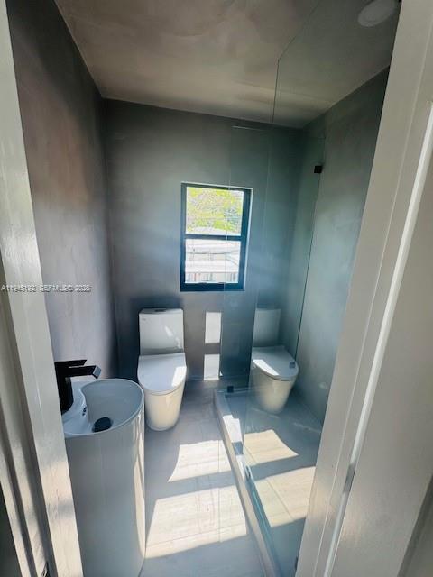905 Southwest 13th Court Miami, FL 33135 - Photo 45 of 51 a bathroom with a toilet and a sink