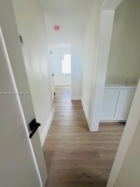 905 Southwest 13th Court Miami, FL 33135 - Photo 47 of 51 a view of a hallway with wooden floor and staircase