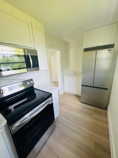 905 Southwest 13th Court Miami, FL 33135 - Photo 50 of 51 a kitchen with sink and refrigerator