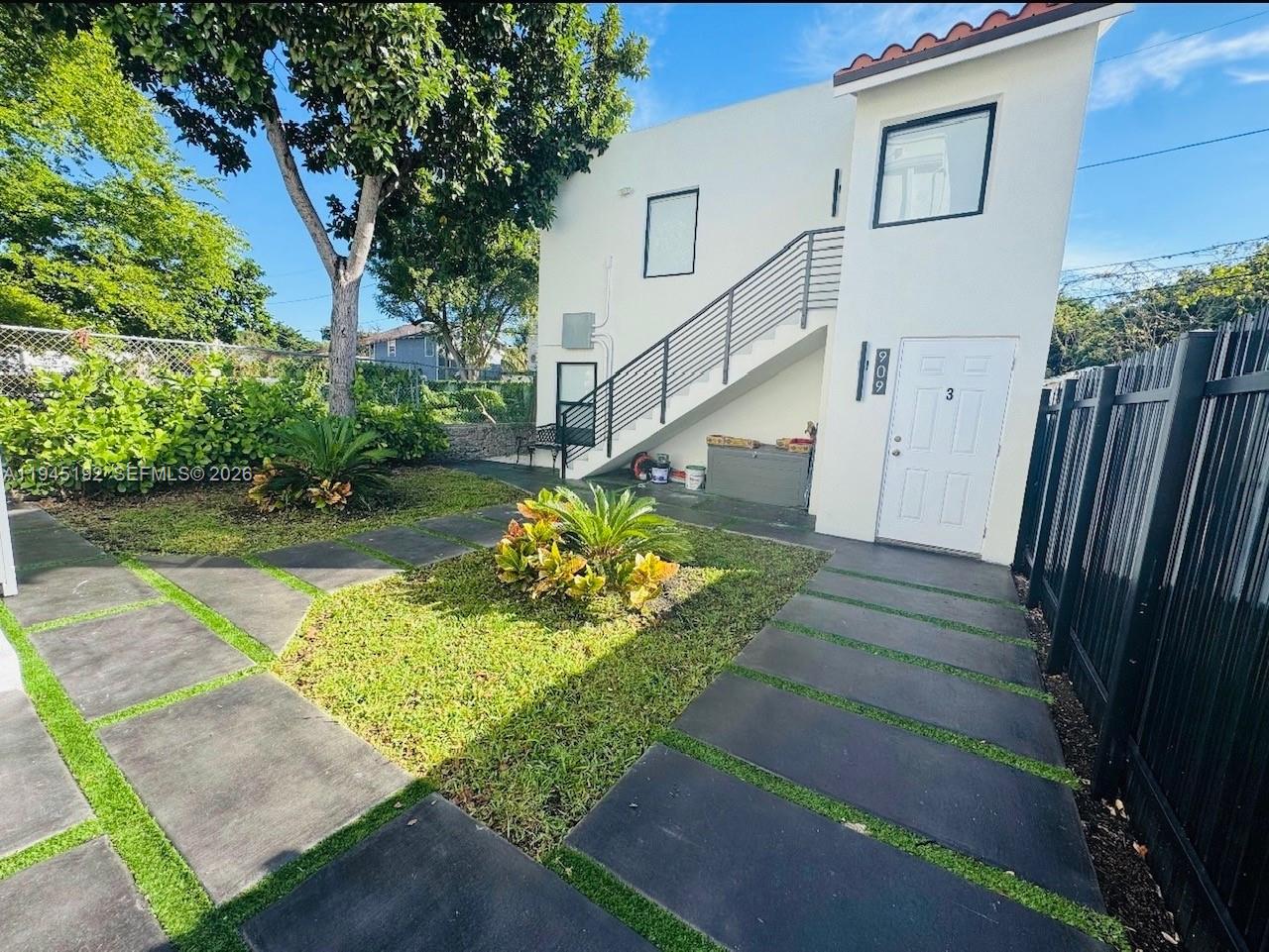 905 Southwest 13th Court Miami, FL 33135 - Photo 5 of 51 a view of a house with a yard
