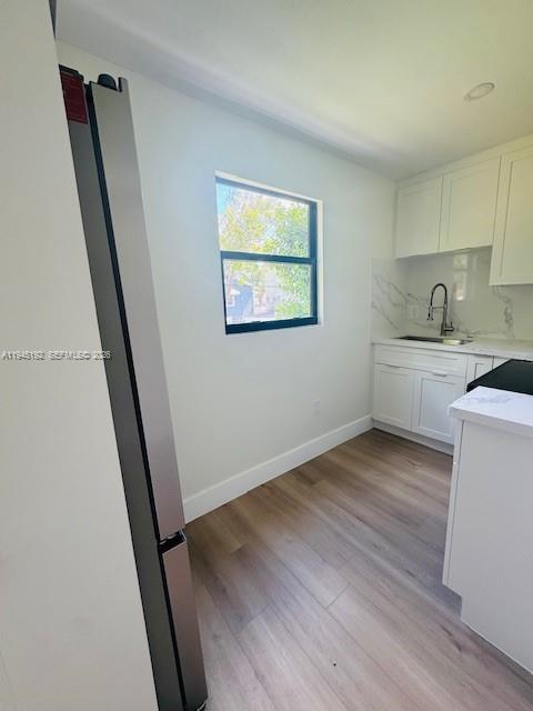 905 Southwest 13th Court Miami, FL 33135 - Photo 51 of 51 a view of a kitchen with sink and wooden floor