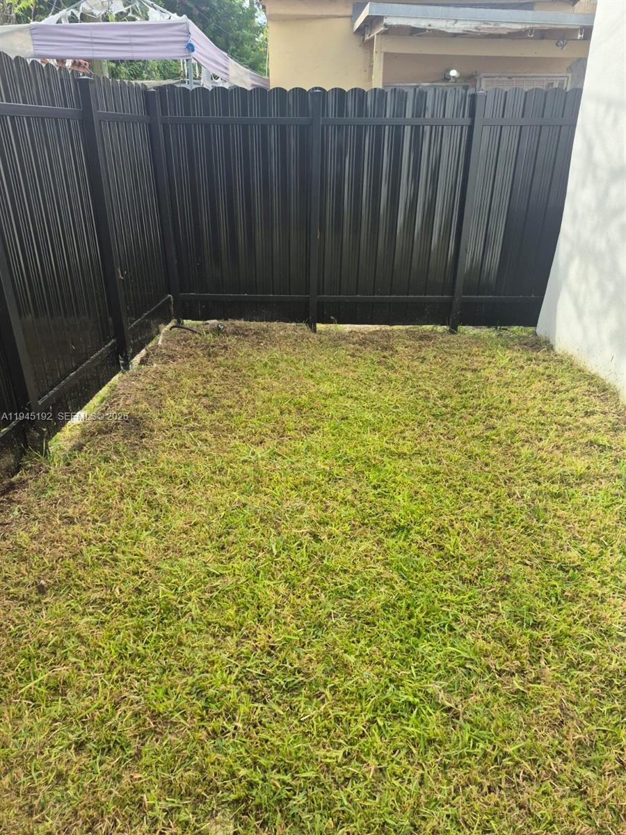 905 Southwest 13th Court Miami, FL 33135 - Photo 8 of 51 a view of wooden door