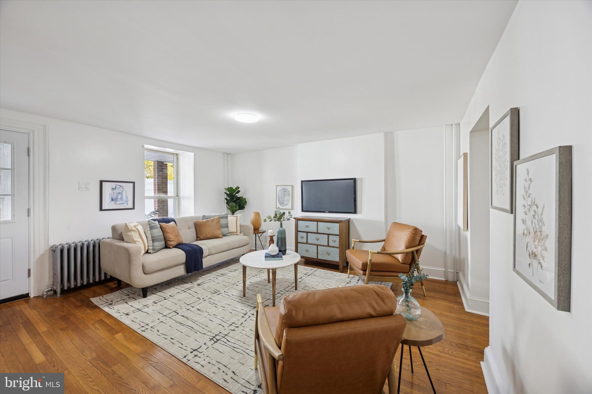 a living room with furniture or couch and a flat screen tv