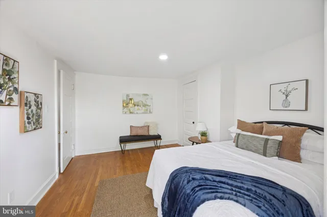 a bedroom with a bed and wall painting