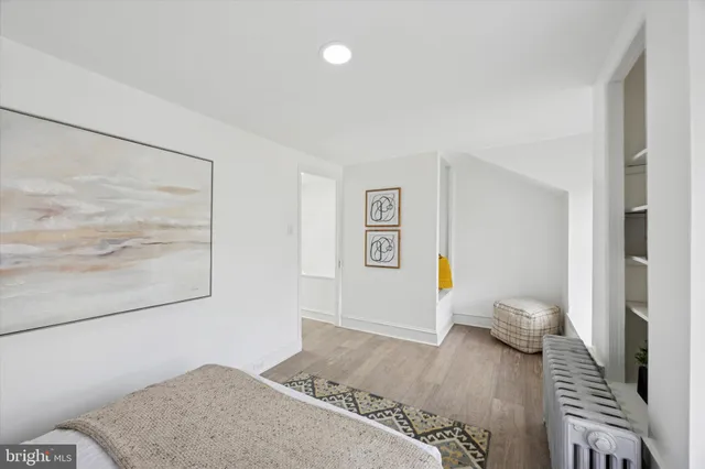 a bedroom with a bed and a couch