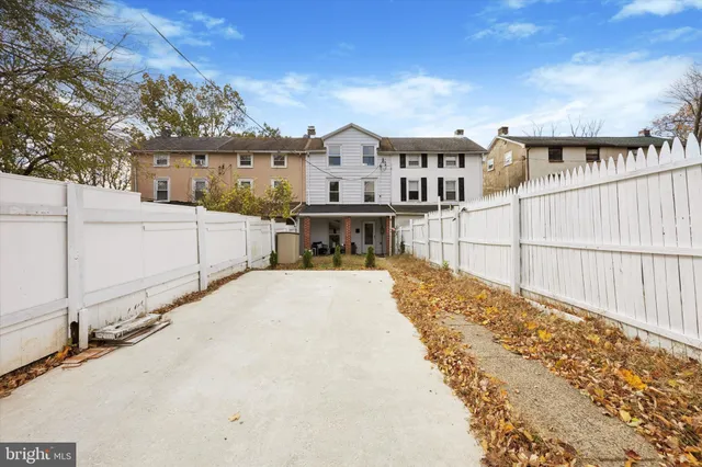 a view of house with wooden fence