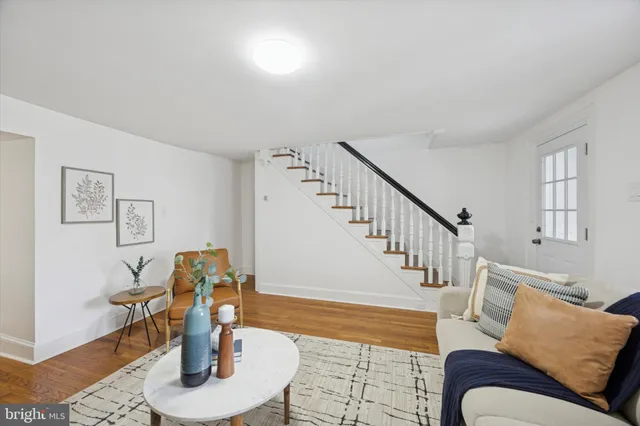 a living room with furniture and a dining table