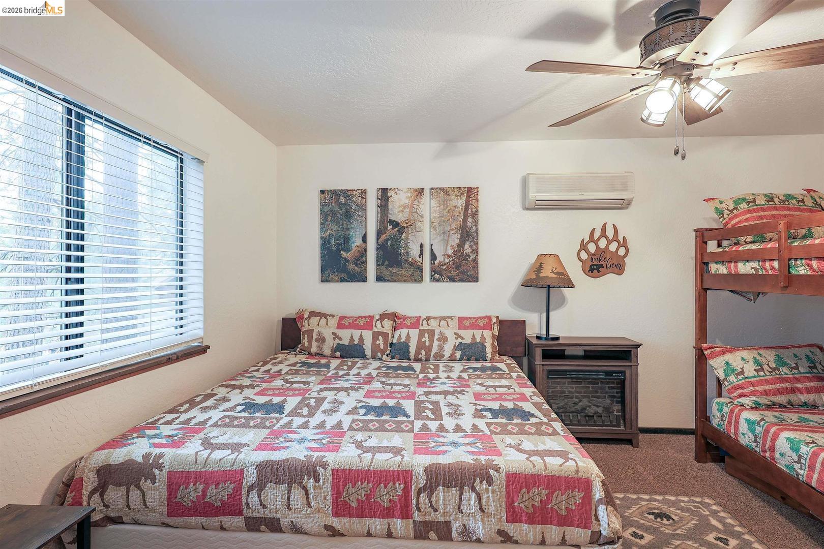 26600 Inyo Drive Cold Springs, CA 95335 - Photo 16 of 38 a bedroom with a bed a dresser and a window