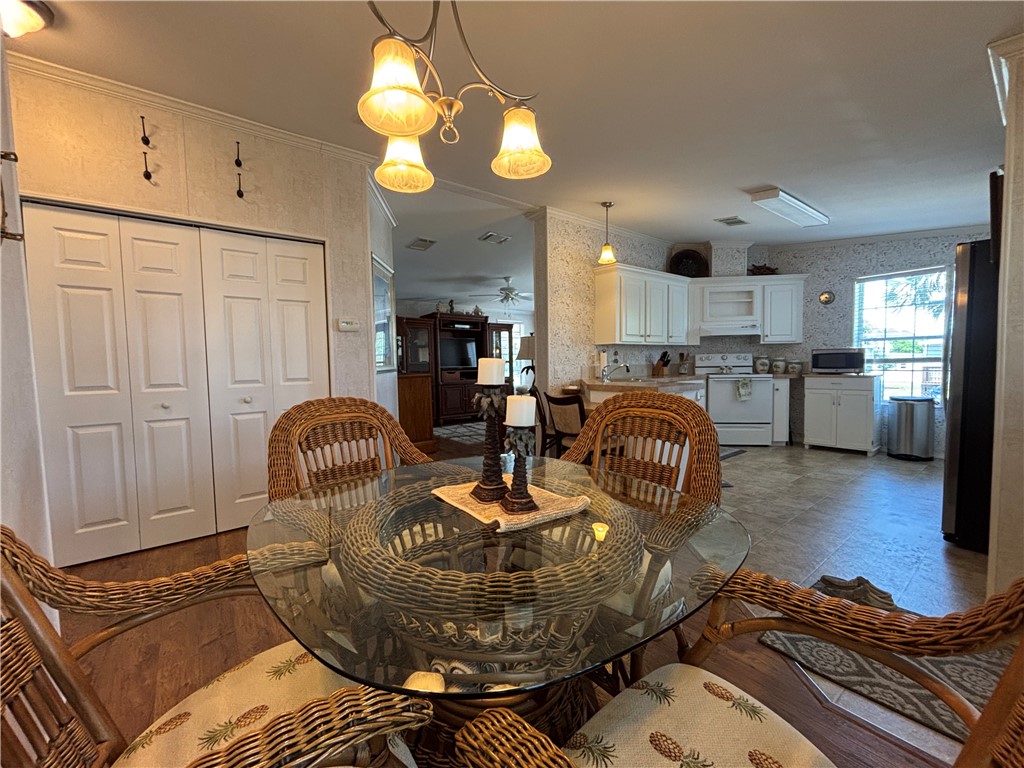 6171 98th Road Sebastian, FL 32958 - Photo 9 of 14 a living room with furniture a dining table and kitchen view