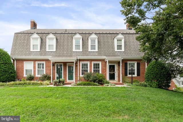 a view of a house with garden and yard