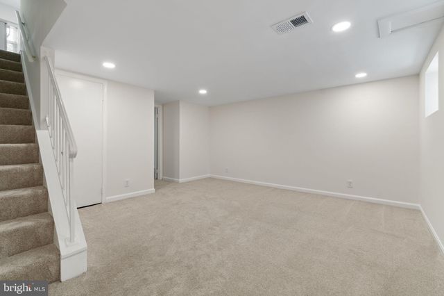 an empty room with a fireplace