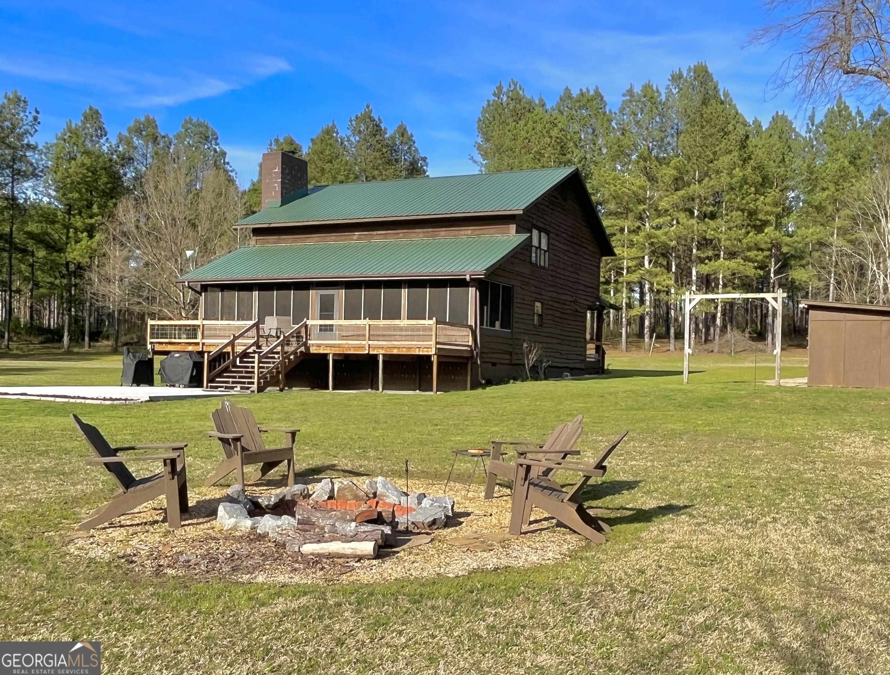 1267 Balchin Road Elberton, GA 30635 - Photo 1 of 1 a view of a house with backyard outdoor seating area and furniture
