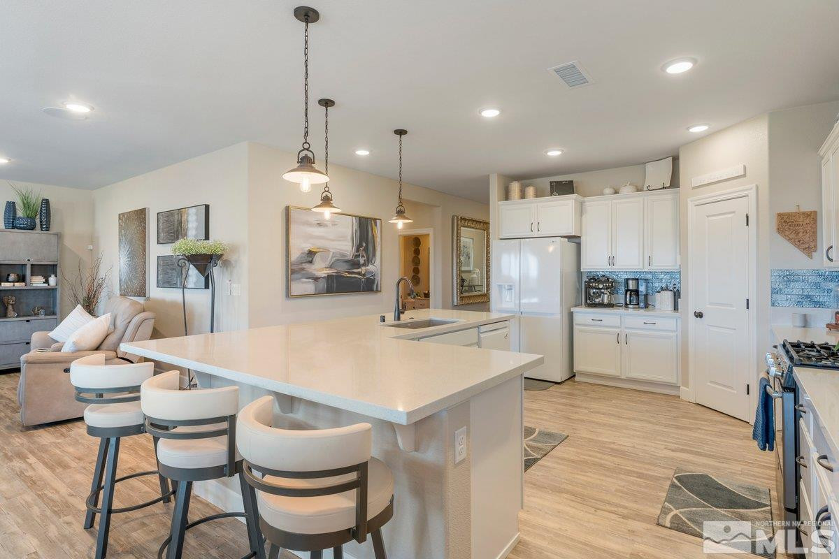 477 Scenic Ridge Drive Reno, NV 89506 - Photo 11 of 40 a large kitchen with kitchen island a large island in it