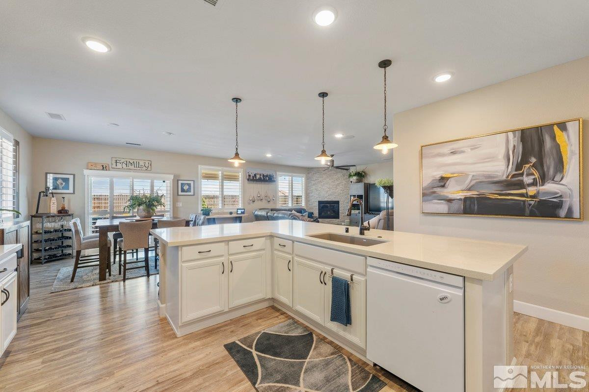 477 Scenic Ridge Drive Reno, NV 89506 - Photo 12 of 40 a kitchen with white cabinets and sink