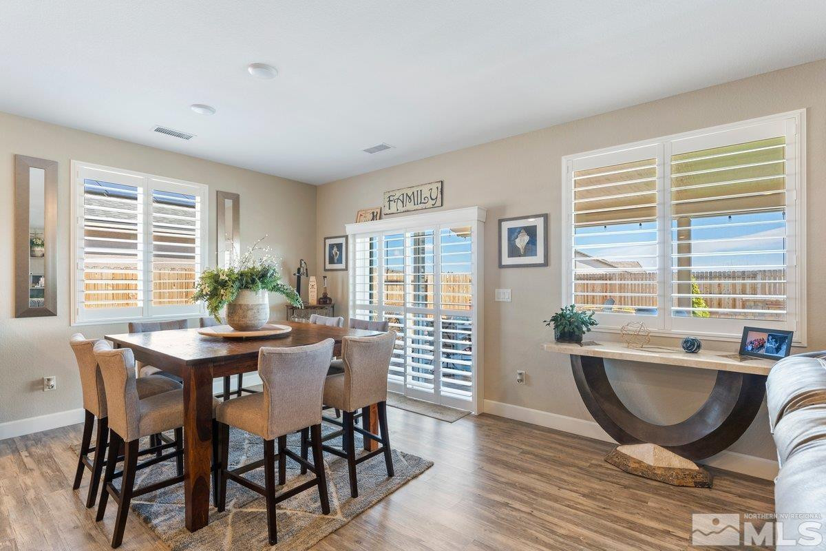 477 Scenic Ridge Drive Reno, NV 89506 - Photo 13 of 40 a view of a dining room with furniture wooden floor and a potted plant