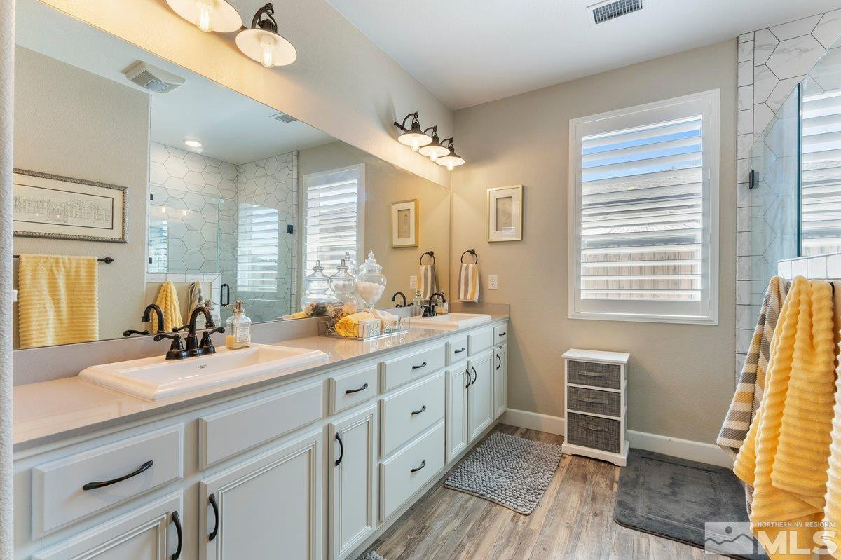 477 Scenic Ridge Drive Reno, NV 89506 - Photo 28 of 40 a bathroom with a double vanity sink and a mirror