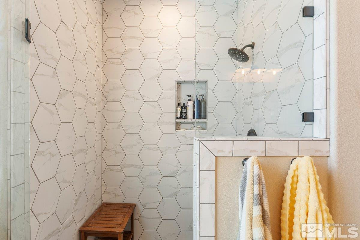 477 Scenic Ridge Drive Reno, NV 89506 - Photo 29 of 40 a bathroom with a sink and a shower curtain