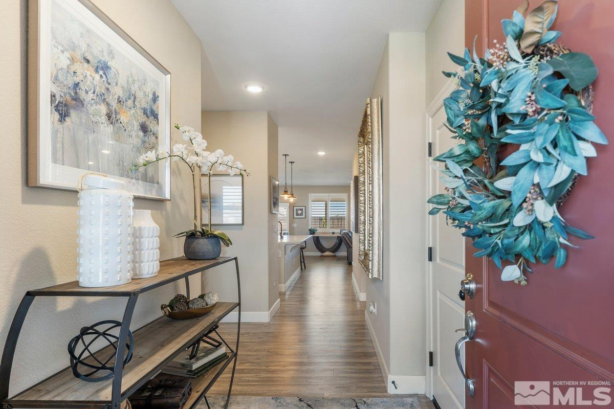 477 Scenic Ridge Drive Reno, NV 89506 - Photo 7 of 40 a living room with furniture gym equipment and a potted plant