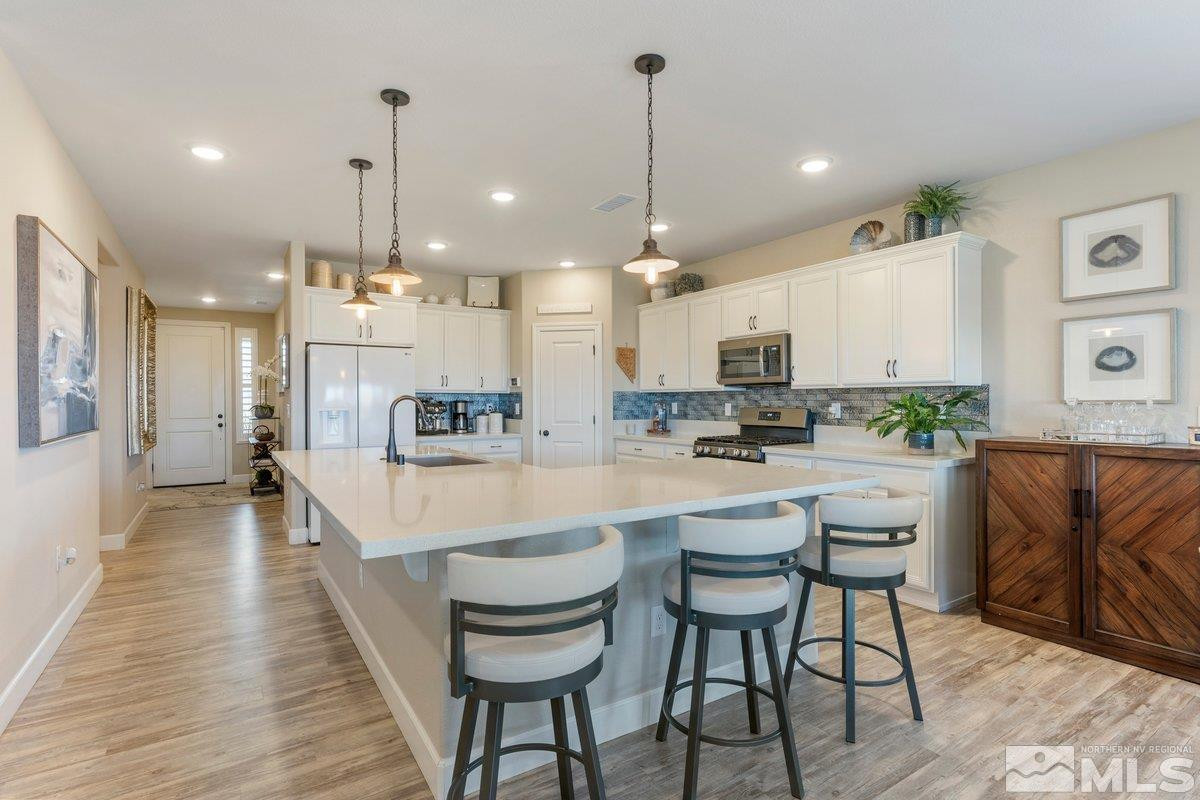 477 Scenic Ridge Drive Reno, NV 89506 - Photo 10 of 40 a large kitchen with a table and chairs